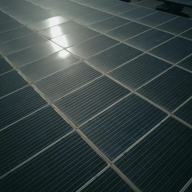 Captivating close-up of solar panels reflecting sunlight, showcasing renewable energy technology.